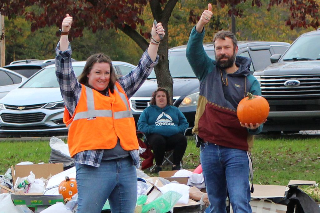 From left: WLES Gifted and Enrichment teacher Lauren Yurko and Physical Education teacher Michael Grimm give the thumbs-up to the students whose pumpkin stayed intact after falling 25 feet. 